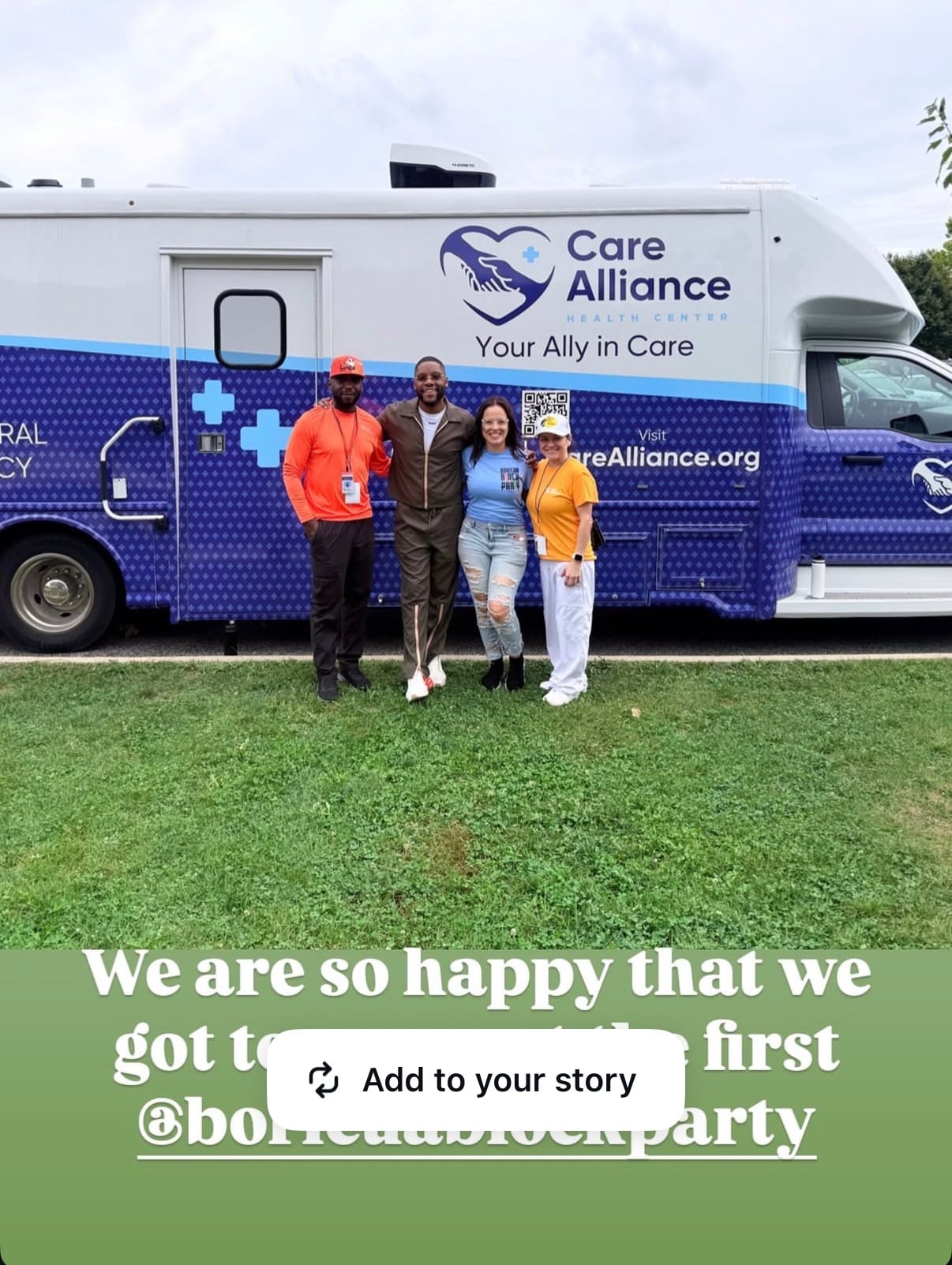 A shared social-media image of four people standing in front of a Care Alliance Health Center vehicle.